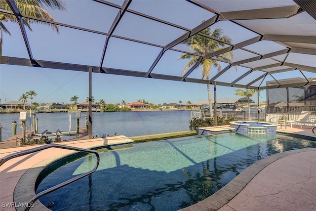 330 SW 33rd Ave, Cape Coral, FL 33991 - view of swimming pool featuring a patio area, a water view, a lanai, a dock, and a pool with connected hot tub