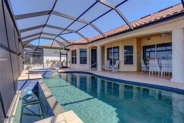 330 SW 33rd Ave, Cape Coral, FL 33991 - view of swimming pool with outdoor dining area, a pool with connected hot tub, a patio area, ceiling fan, and a lanai