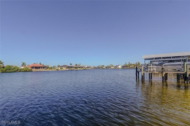 330 SW 33rd Ave, Cape Coral, FL 33991 - view of dock with a water view and boat lift