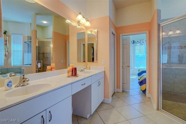 330 SW 33rd Ave, Cape Coral, FL 33991 - ensuite bathroom with tile patterned floors, a stall shower, ensuite bathroom, and a sink