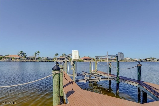 330 SW 33rd Ave, Cape Coral, FL 33991 - dock area with boat lift and a water view