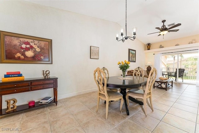 dining space featuring light tile patterned floors, ceiling fan with notable chandelier, baseboards, and lofted ceiling