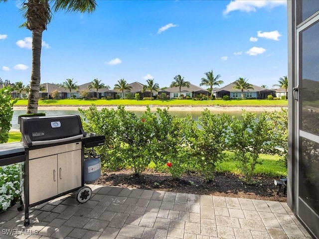 2138 Marquesa Cir, Naples, FL 34112 - view of patio with a residential view and a grill