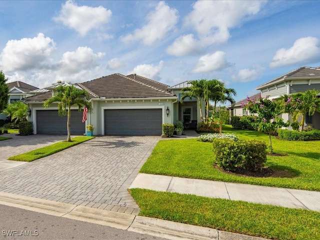 2138 Marquesa Cir, Naples, FL 34112 - single story home featuring a garage, decorative driveway, and a front lawn
