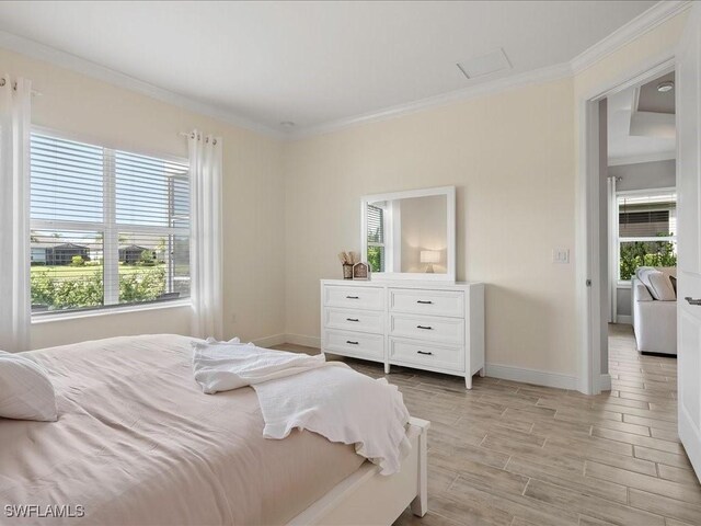 2138 Marquesa Cir, Naples, FL 34112 - bedroom with ornamental molding, multiple windows, baseboards, and light wood-type flooring