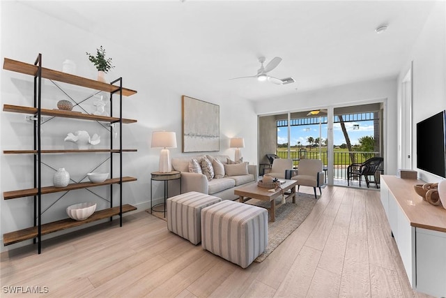 7915 Mahogany Run Ln Unit 1126, Naples, FL 34113 - living area featuring light wood-type flooring and a ceiling fan