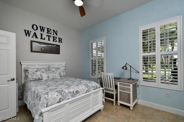 bedroom featuring baseboards and a ceiling fan