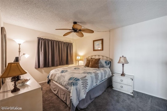 bedroom with dark colored carpet, a textured ceiling, a ceiling fan, and baseboards