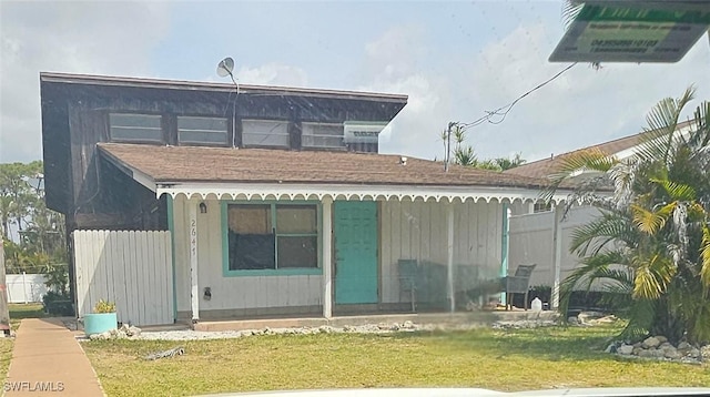 2631 Becca Ave, Naples, FL 34112 - back of house featuring a yard and a shingled roof