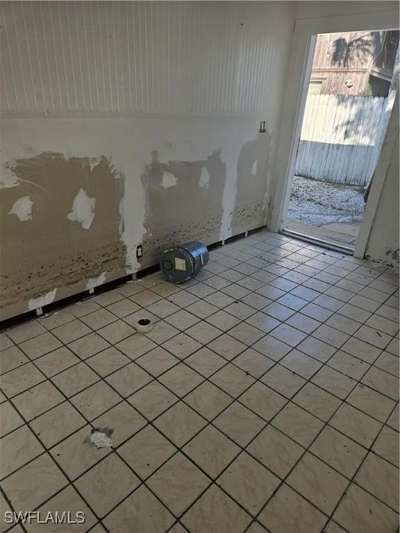 2631 Becca Ave, Naples, FL 34112 - empty room with light tile patterned floors