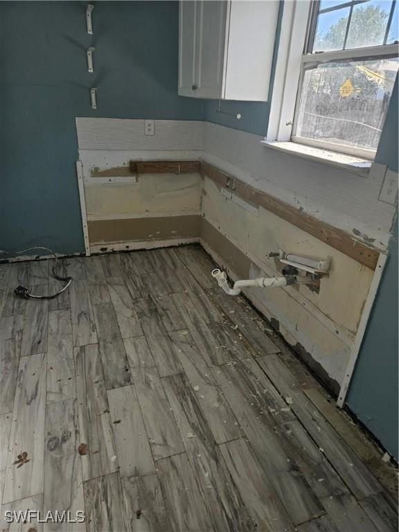 2631 Becca Ave, Naples, FL 34112 - laundry area featuring wood finished floors