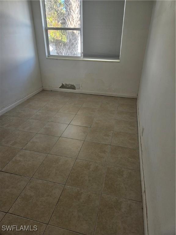 2631 Becca Ave, Naples, FL 34112 - tiled empty room with baseboards