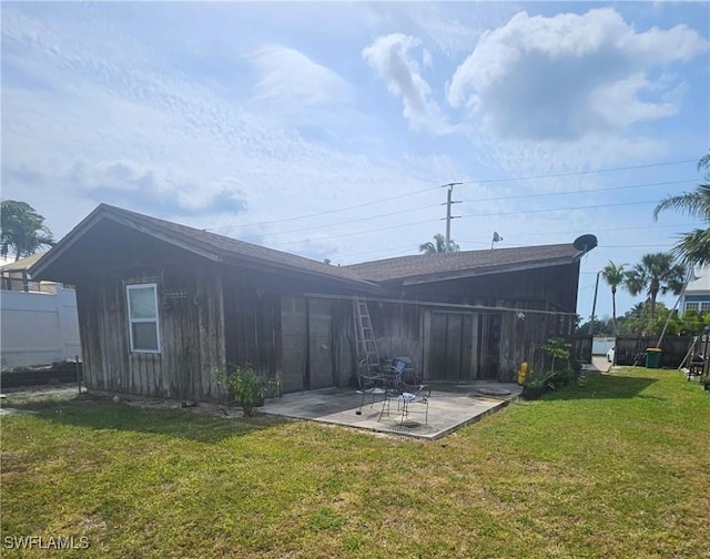 2631 Becca Ave, Naples, FL 34112 - rear view of property featuring a patio and a lawn
