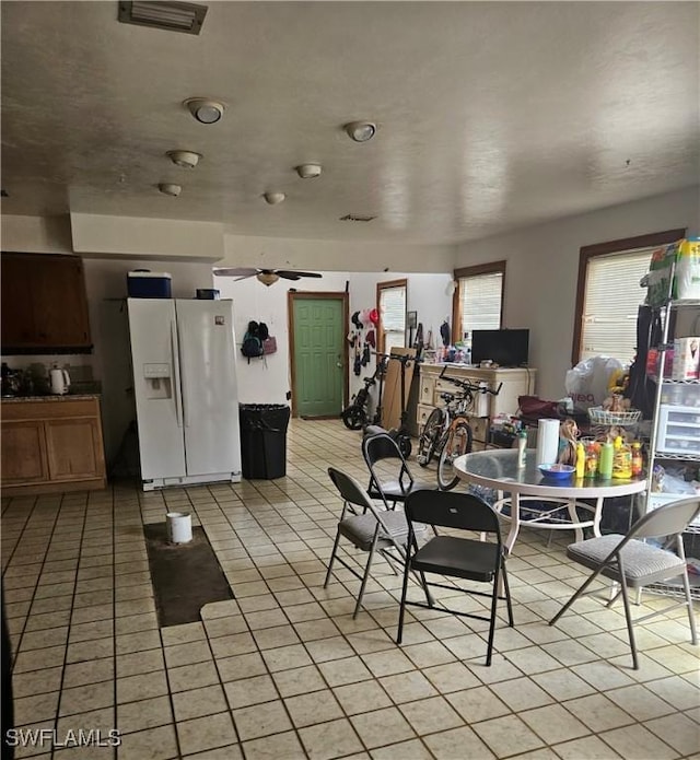 2631 Becca Ave, Naples, FL 34112 - dining space with light tile patterned floors and visible vents