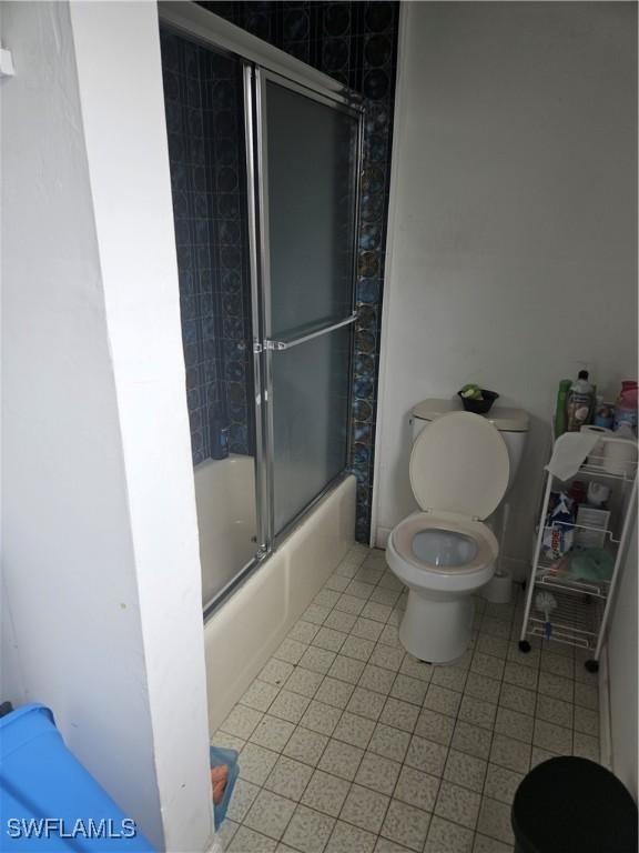 2631 Becca Ave, Naples, FL 34112 - full bathroom with shower / bath combination with glass door and toilet