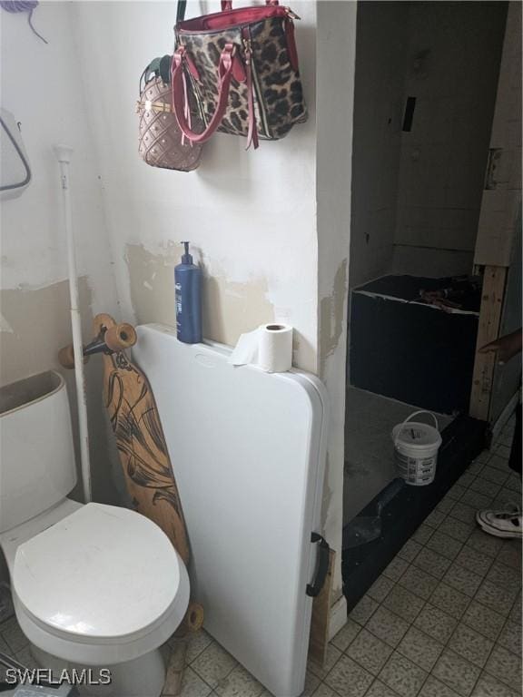 2631 Becca Ave, Naples, FL 34112 - bathroom with toilet and tile patterned floors