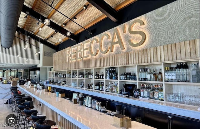 2631 Becca Ave, Naples, FL 34112 - bar featuring high vaulted ceiling, beamed ceiling, and a dry bar