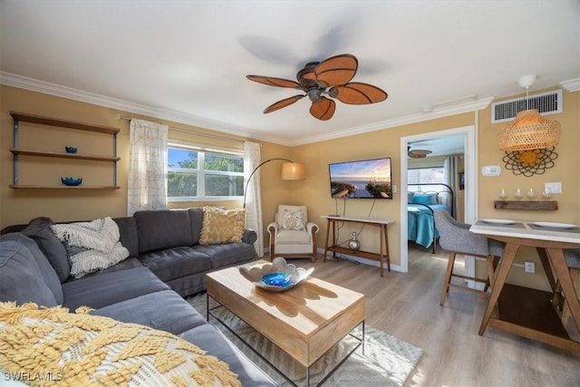 780 10th Ave S Unit 24, Naples, FL 34102 - living room featuring a ceiling fan, crown molding, and light wood-style flooring