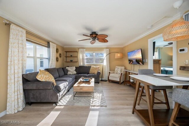 780 10th Ave S Unit 24, Naples, FL 34102 - living room featuring a ceiling fan, crown molding, light wood-style flooring, and baseboards