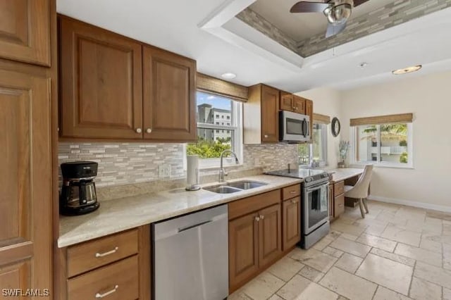 4361 Bay Beach Ln Unit 224, Fort Myers Beach, FL 33931 - kitchen featuring stainless steel appliances, plenty of natural light, a sink, and tasteful backsplash