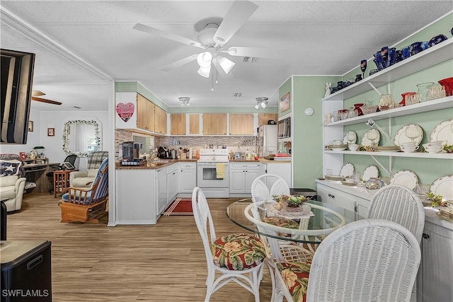 dining room with light wood-style floors and ceiling fan