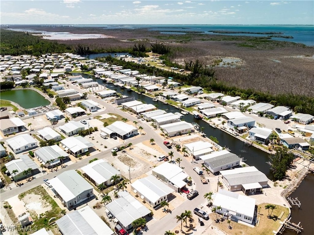 aerial view with a water view and a residential view