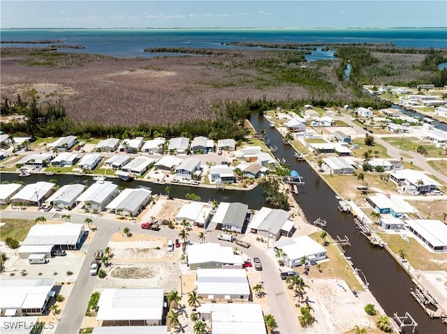 aerial view featuring a residential view and a water view