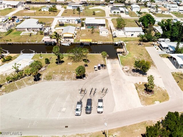 bird's eye view with a residential view and a water view