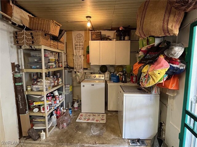 356 3rd Ave, Marco Island, FL 34145 - washroom featuring cabinet space, water heater, wood ceiling, and washing machine and dryer