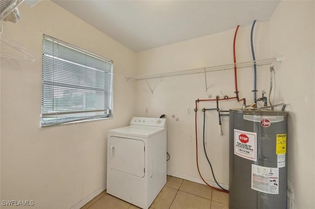 26136 Explorer Rd, Punta Gorda, FL 33983 - laundry area with washer / dryer, electric water heater, light tile patterned floors, and baseboards