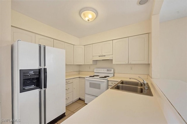 26136 Explorer Rd, Punta Gorda, FL 33983 - kitchen featuring white appliances, a sink, under cabinet range hood, light tile patterned floors, and light countertops