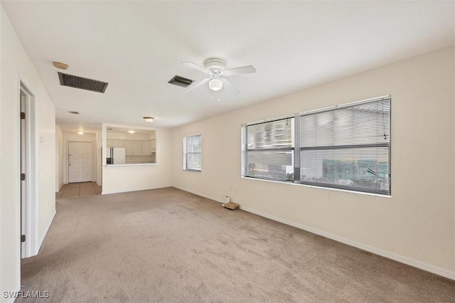 26136 Explorer Rd, Punta Gorda, FL 33983 - spare room with light colored carpet, ceiling fan, and baseboards