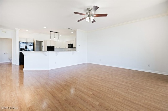 6081 Waterway Bay Dr, Fort Myers, FL 33908 - unfurnished living room featuring light wood finished floors, crown molding, baseboards, and ceiling fan