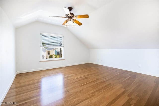 6081 Waterway Bay Dr, Fort Myers, FL 33908 - bonus room with baseboards, vaulted ceiling, wood finished floors, and ceiling fan