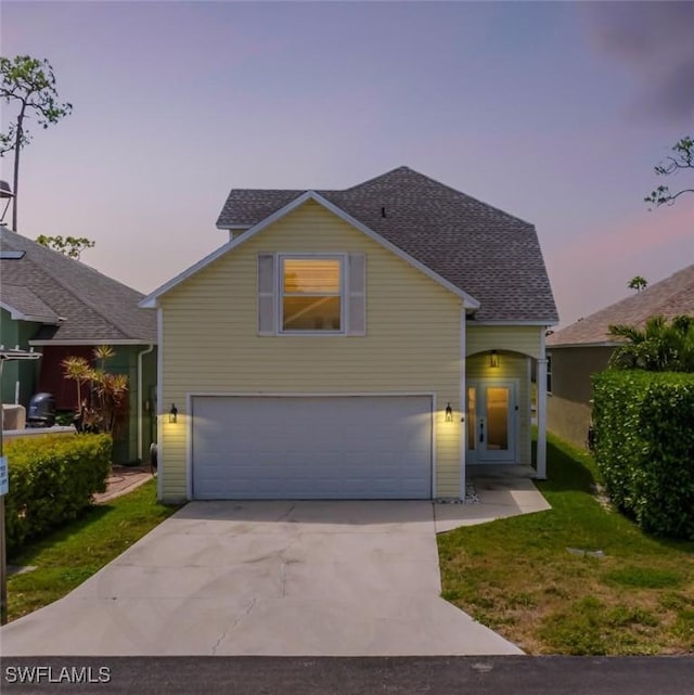 6081 Waterway Bay Dr, Fort Myers, FL 33908 - traditional-style home featuring a garage, roof with shingles, a front lawn, and concrete driveway