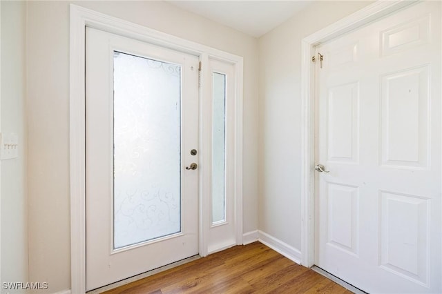 6081 Waterway Bay Dr, Fort Myers, FL 33908 - entryway featuring wood finished floors and baseboards