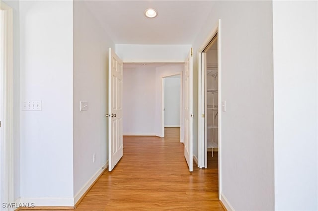 6081 Waterway Bay Dr, Fort Myers, FL 33908 - hallway featuring recessed lighting, light wood-type flooring, and baseboards