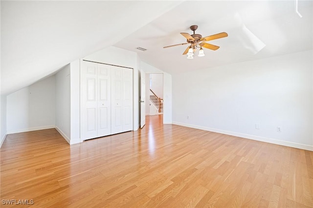 6081 Waterway Bay Dr, Fort Myers, FL 33908 - interior space with baseboards, vaulted ceiling, a closet, and light wood-type flooring