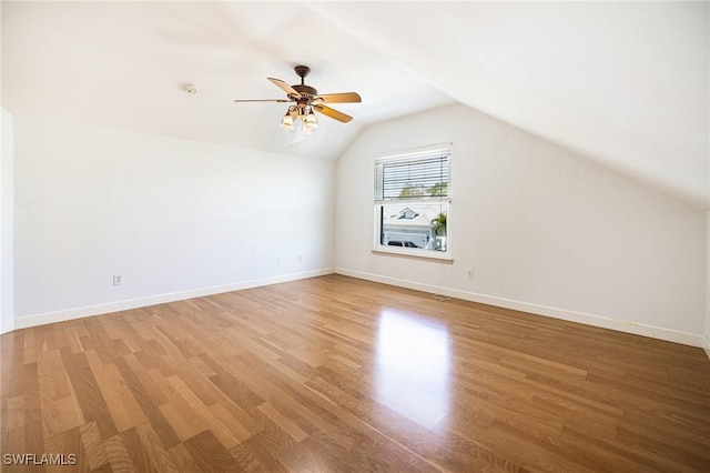 6081 Waterway Bay Dr, Fort Myers, FL 33908 - bonus room with lofted ceiling, a ceiling fan, light wood-style floors, and baseboards