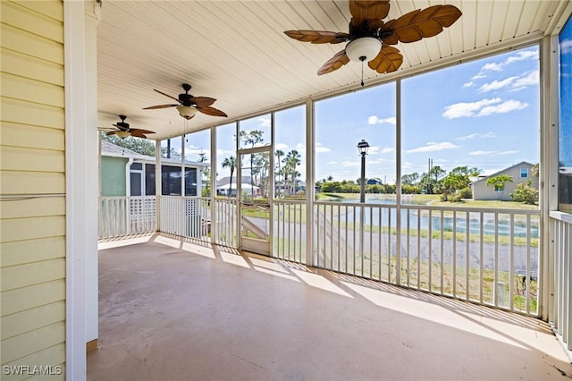 6081 Waterway Bay Dr, Fort Myers, FL 33908 - unfurnished sunroom with a ceiling fan and a water view