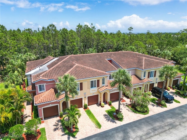 aerial view featuring a wooded view