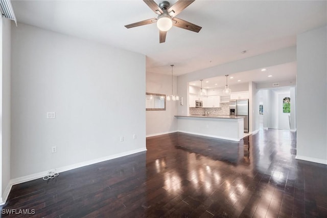 unfurnished living room with baseboards, recessed lighting, a ceiling fan, and dark wood-type flooring