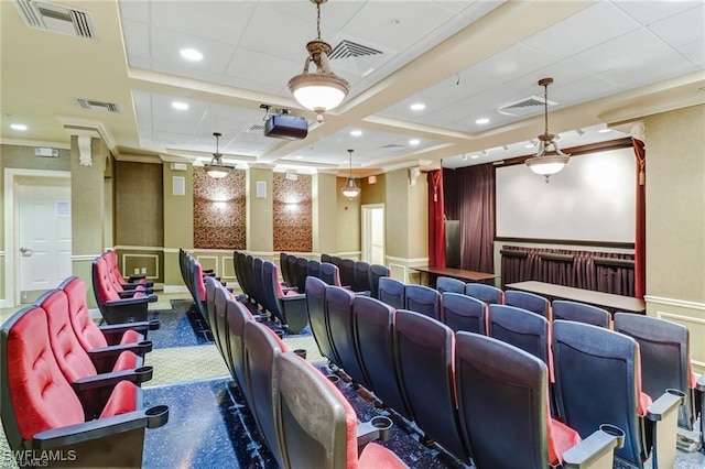 cinema featuring visible vents, wainscoting, and a decorative wall