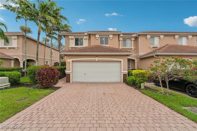 17577 Cherry Ridge Ln, Fort Myers, FL 33967 - view of front of property featuring a tiled roof, stucco siding, a front yard, and decorative driveway