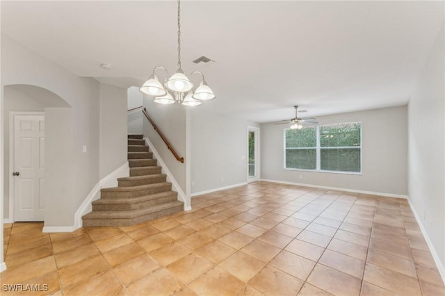 17577 Cherry Ridge Ln, Fort Myers, FL 33967 - empty room featuring stairway, light tile patterned flooring, visible vents, arched walkways, and ceiling fan with notable chandelier