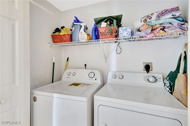 laundry area featuring laundry area and washing machine and clothes dryer