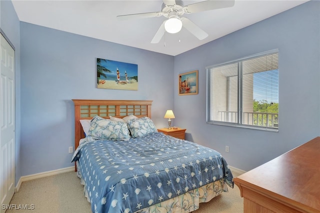 bedroom featuring a closet, carpet flooring, baseboards, and a ceiling fan