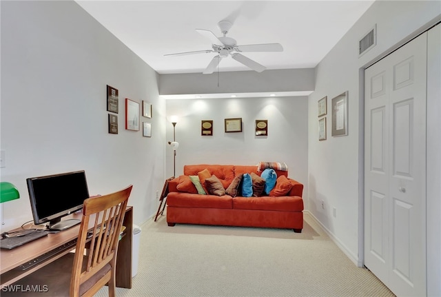 carpeted living room with baseboards, a ceiling fan, and visible vents