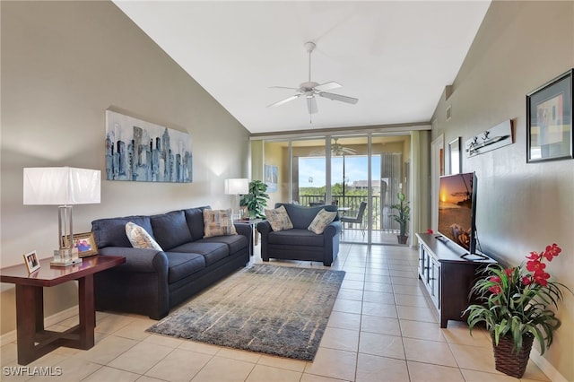 living area featuring lofted ceiling, baseboards, light tile patterned floors, a ceiling fan, and a wall of windows