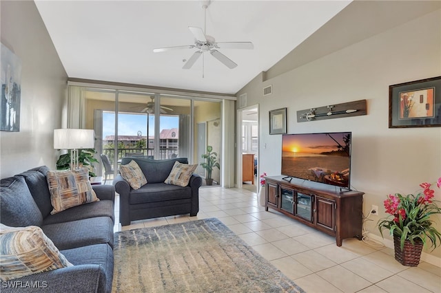 living room with baseboards, light tile patterned floors, visible vents, ceiling fan, and high vaulted ceiling